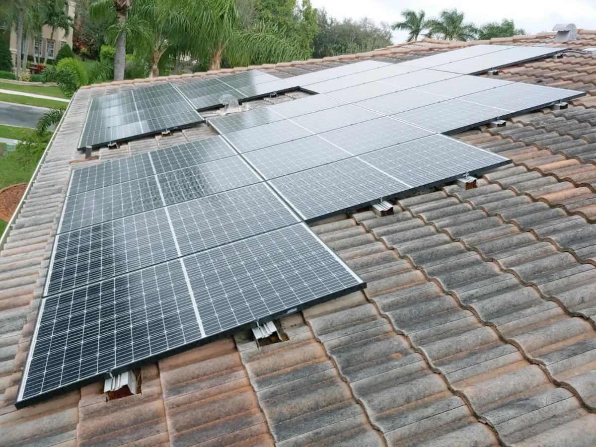 Rows of solar panels on a tile roof after a re-rack